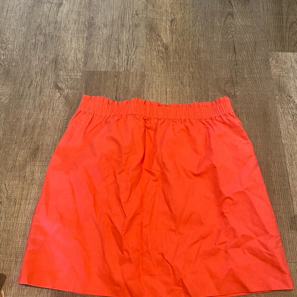New with tags J Crew skirt. Beautiful coral color!